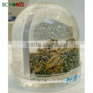 Plastic snow globe with photo insert