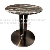 Hotel table with stone top and metal base