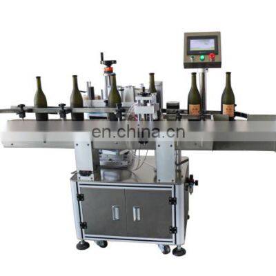 Automated round bottle labeling machine for multi height diameter bottles