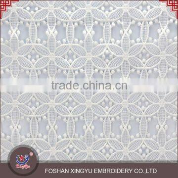 Wholesale china OEM factory net dress making embroidered lace fabric designs