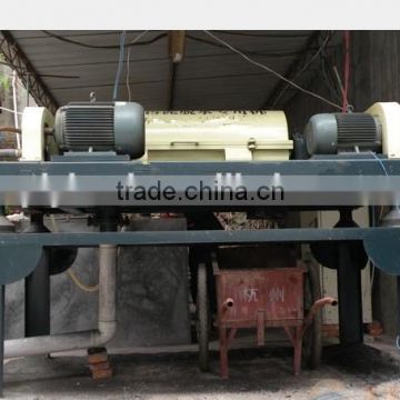 Sludge dewatering centrifuge