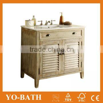 Beach style bath cabinet with marble top