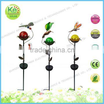 Butterfly dradonfly hummingbird with a glass ball solar light metal stake