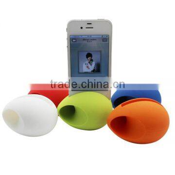 Egg shape silicone loudspeaker / silicone phone holder