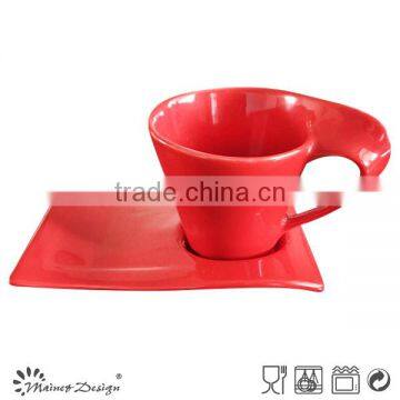 RED STONEWARE IRREGULAR SHAPE TEA CUP&SAUCER