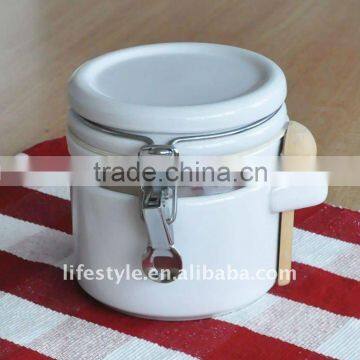 Ceramic spices jar with wooden spoon, storage bottle