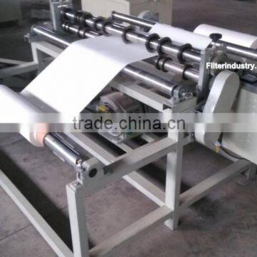 Filter media slitting and rewinding machine