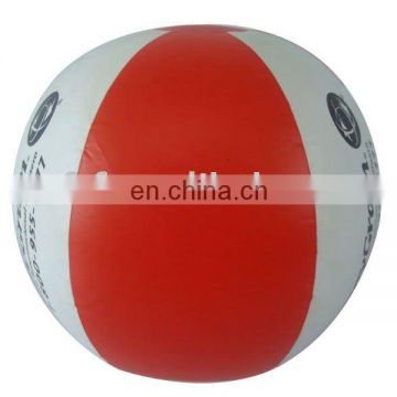 red and white inflatable beach ball