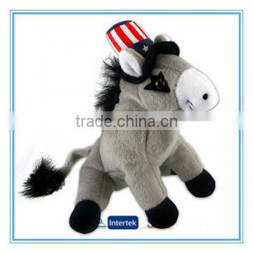 Plush stuffed donkey toy with a hat