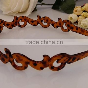 Women's nice looking fancy design headband plastic brown hollow out hair band