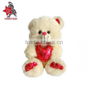 Stuffed soft plush bear with love heart