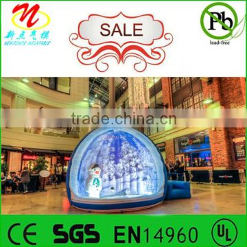 The giant inflatable snow globe for window displays