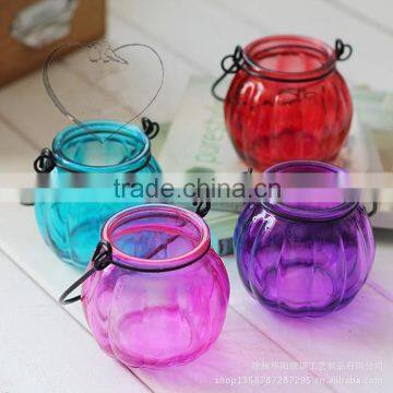 Colored round candle glass jar with scented candle