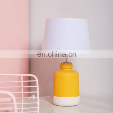 UK simple customize small cylinder ceramic cheap matte desk lamps for hotel bedside