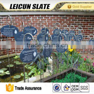 Outdoors decorative slate hanging on the wall black stone label