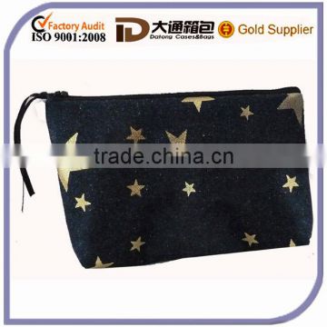 Beautiful zip cosmetic bag made from denim fabric with metallic gold star print