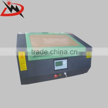 China DW-5030 mini automatic new design portable co2 laser engraving and cutting machine price