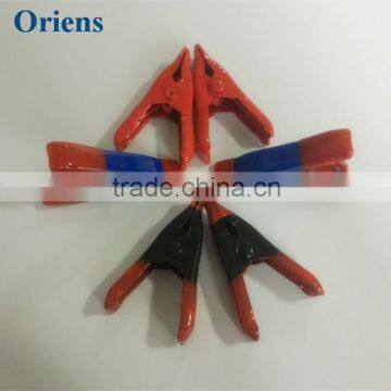 black spring clip red tent clamp