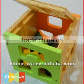 wood cube shape sorter toy with sorting pattern blocks