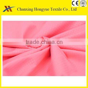 Embossed pattern Microfiber peach skin solid color with embossed textile fabric from changxing factory