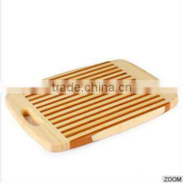 Bamboo chopping board with holes