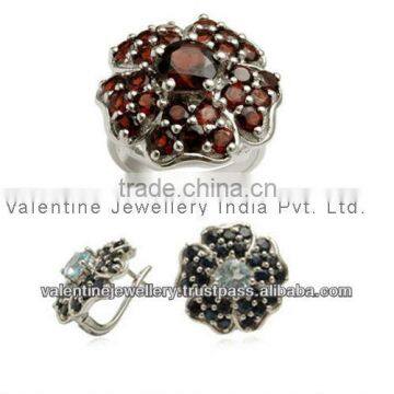 designer ring and earring set studded with garnet onyx and blue topaz as costume set jewellery