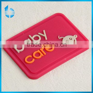 Soft washable Clothing PVC customized rubber label, silicon 3D label for baby care products