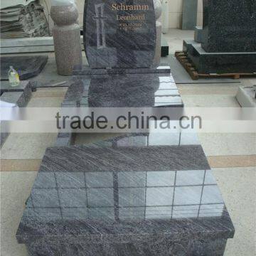 European style granite cross headstones with kerbs