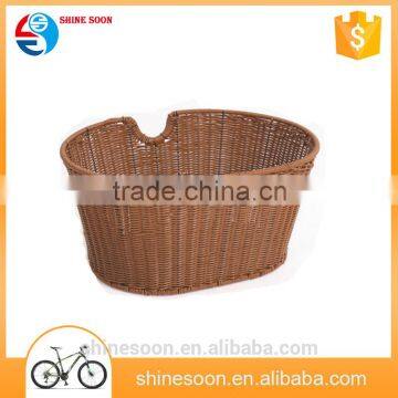 Brown bicycle front woven plastic storage basket