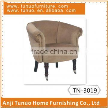 Accent chair,handle with nails,velvet cover with piping,front legs with wheel.TN-3019