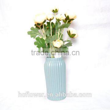 Elegant artificial Rose planted in ceramic pot for decoration