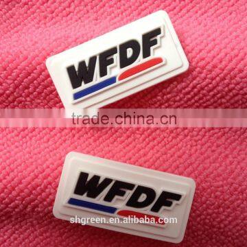 Clean white rubber label for staff clothes