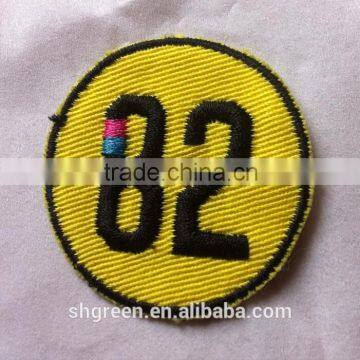 Gold color twill number embroidery patch with trim