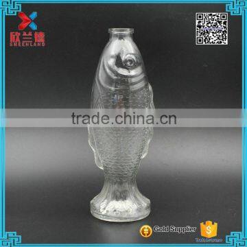 wholesale 500ml food grade decorative fish shape beverage glass bottles