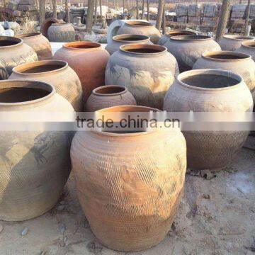 antique large round clay pot