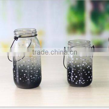 Glass candle jar with star decal and metal handle for wholesales