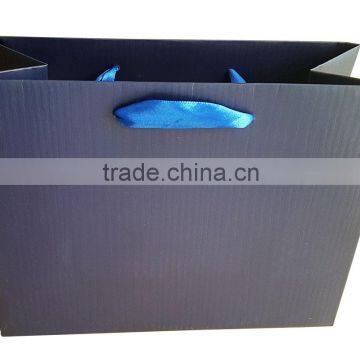 Dark blue paper shoping gift bag with line embossing