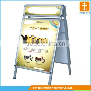 A frame stand banner of portable, laminated poster board