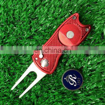 retractable Switchblade golf divot tool with ball marker