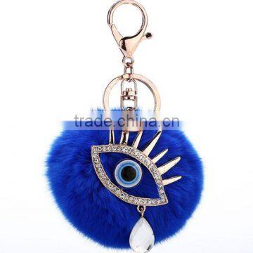 Custom blue Rabbit Fur ball keychain with Evil eye pendant                        
                                                Quality Choice