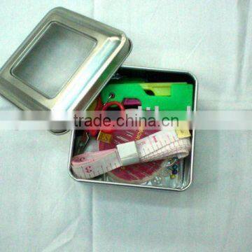 mini home sewing kit in a metal box