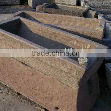 garden old trough in red sandstone