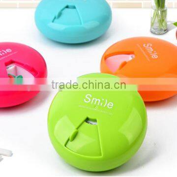 delicate bright-coloured plastic round pocket pill box 7 compartments