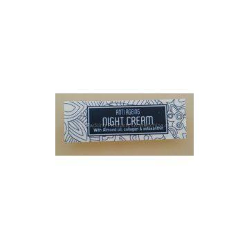 anti ageing night cream bottle labels with flower pattern background