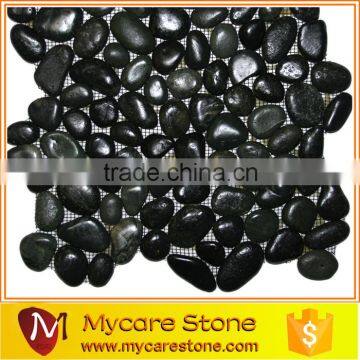 Polished black round pebble