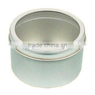 small round tin box with window