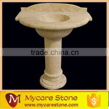 Beige marble pedestal sink with top