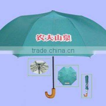 Two folded umbrella with wooden handle