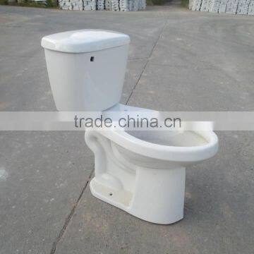 Skirted bowl elongated shape two piece coupled toilet