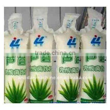 Four nozzles beverage packing machine